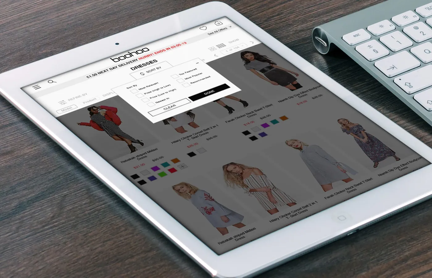 Filter and sort panel open on a tablet over the dresses grid