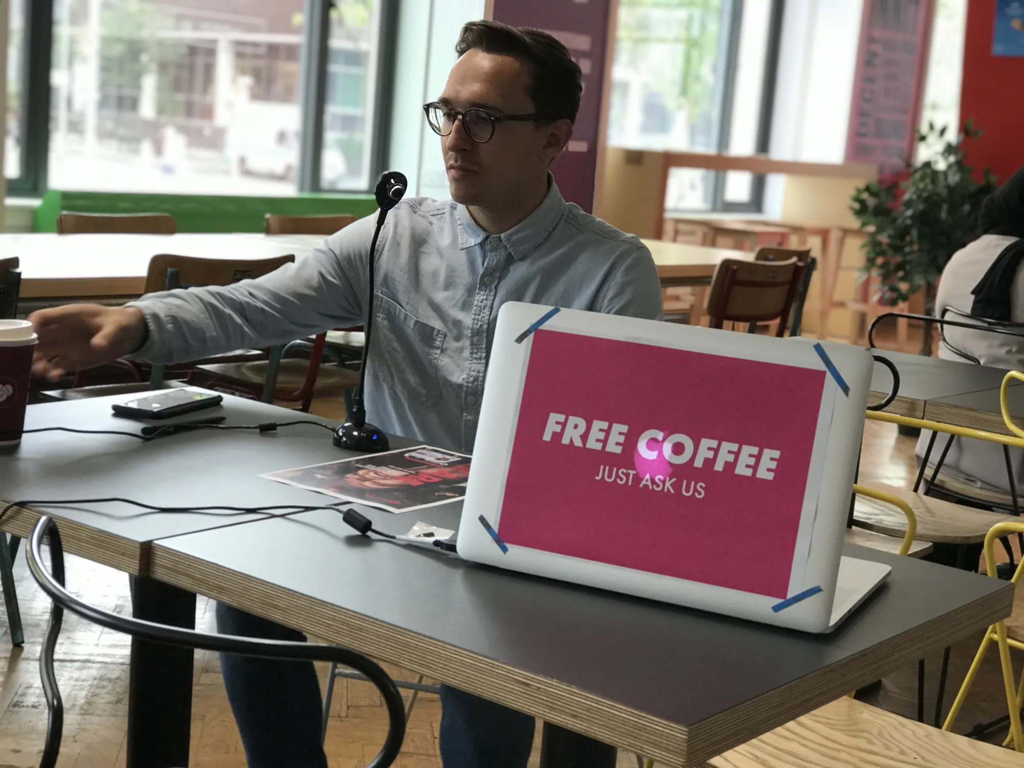Recruiting students for testing on campus — a free coffee sign set up on the interview table